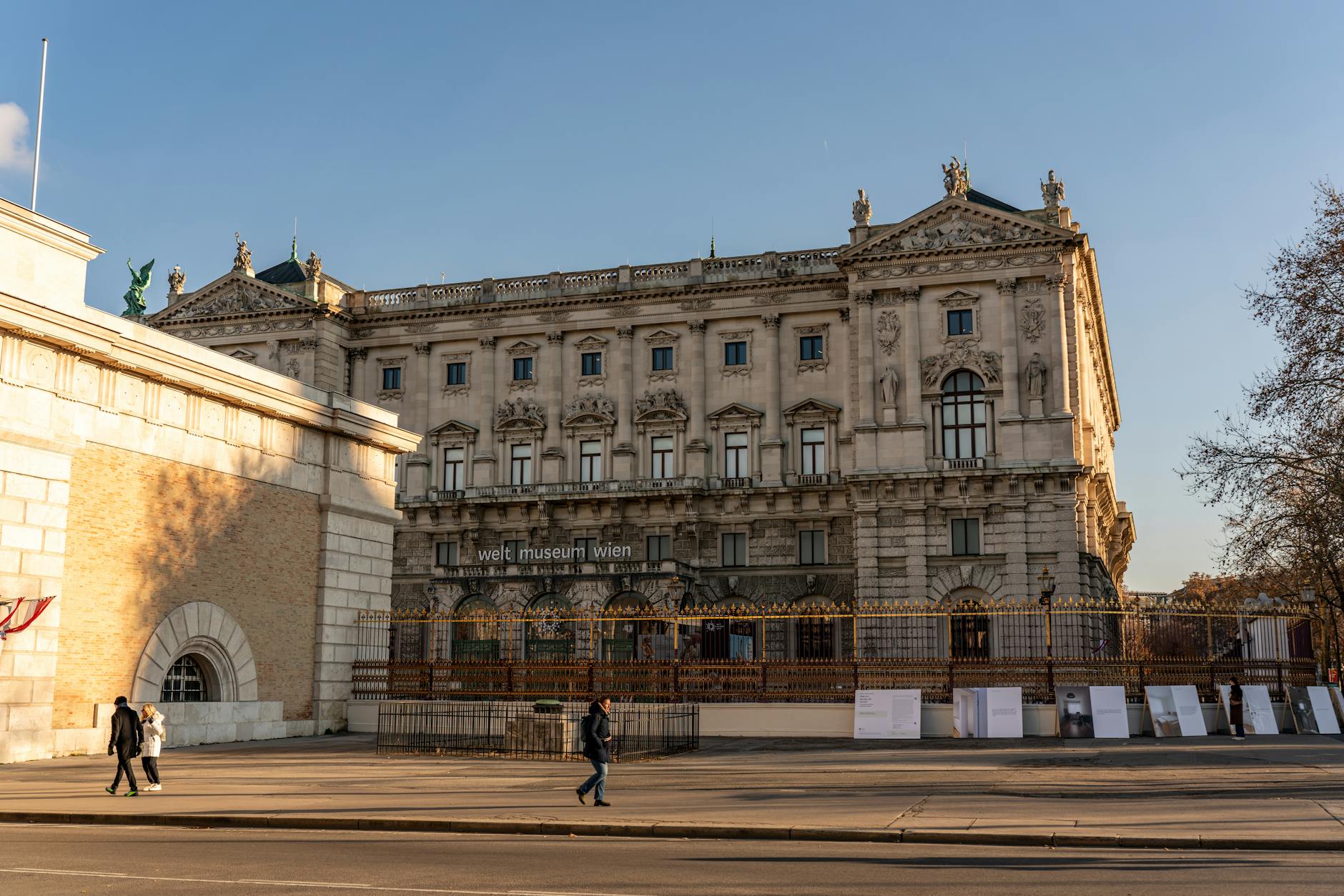 Historic Weltmuseum Wien facade in Vienna, Austria captured on a sunny day with pedestrians.